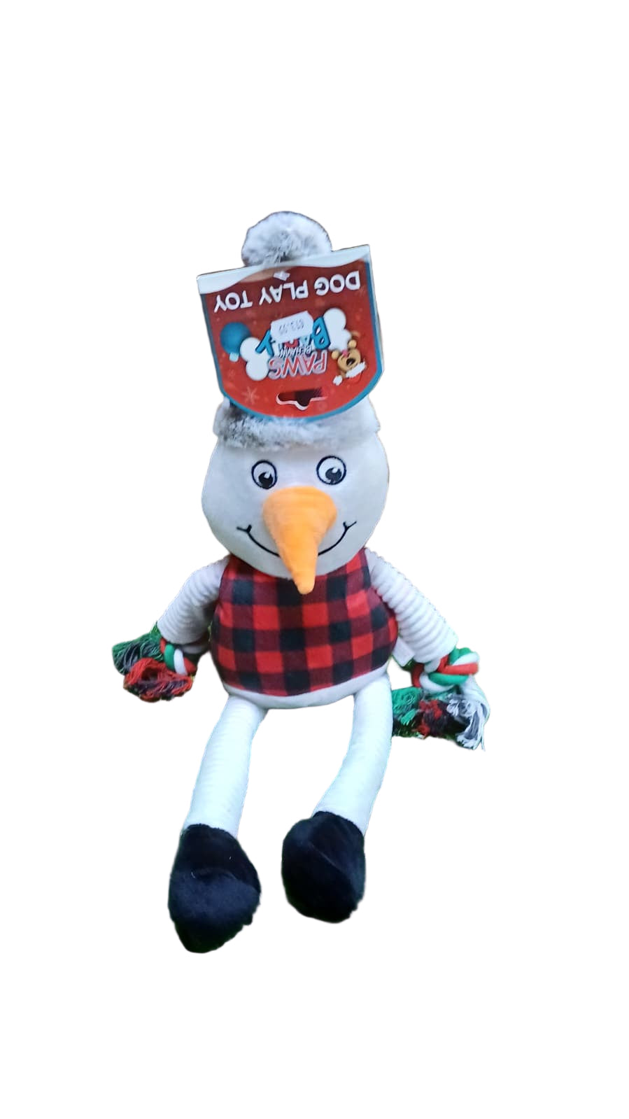 Dog toy shaped like a snowman with a red plaid shirt on a grassy surface.