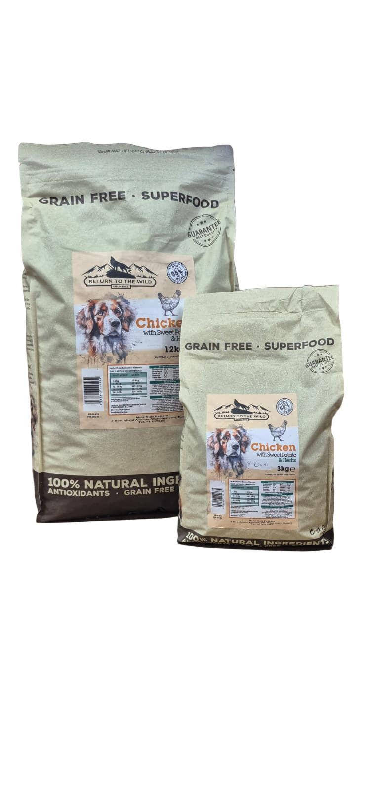 Two bags of grain-free chicken flavoured food for dogs on a wooden surface.