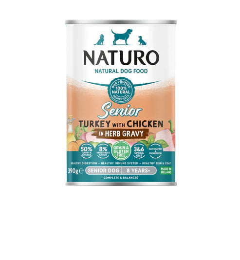 NATURO natural dog food can for senior dogs with turkey and chicken in herb gravy on a light blue background.
