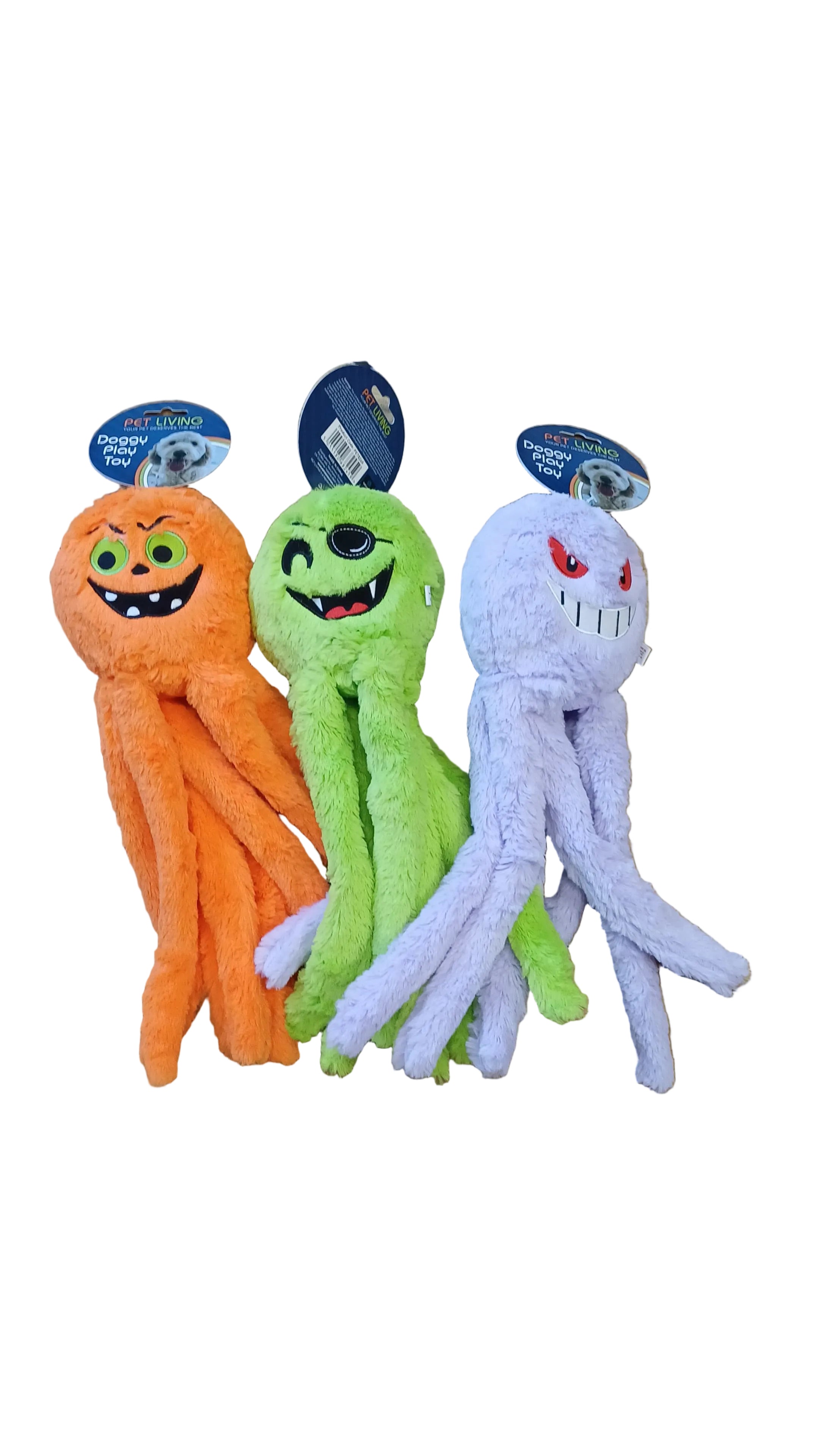 Three Halloween-themed dog toys on a wooden floor.